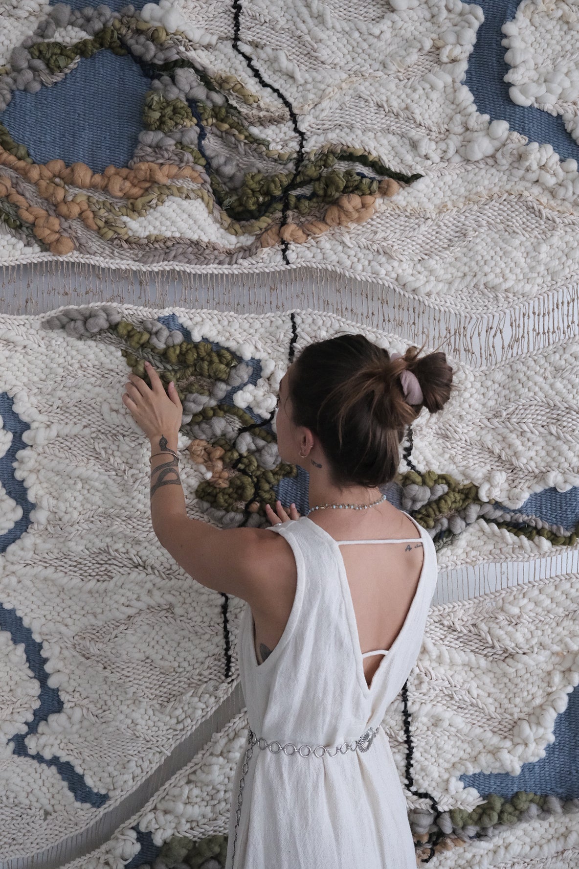 Handwoven fiber art wall hanging made from natural materials such as wool and cotton. Large-scale contemporary woven tapestry featuring rich textures, layered patterns, and abstract designs. Modern textile art for high-end interiors, art collectors, and design enthusiasts.