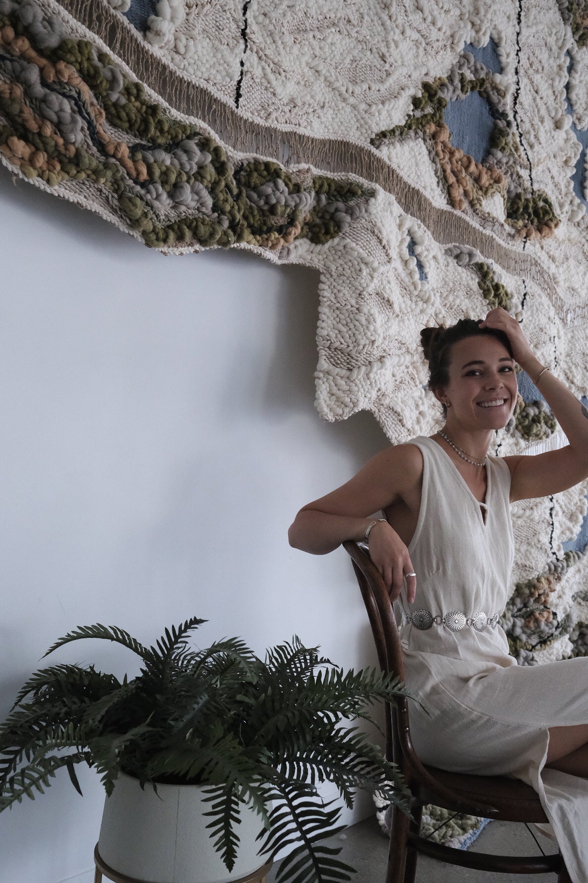 Modern abstract wall hanging in woven wool and cotton. Contemporary fiber art featuring intricate textures and harmonious color palettes.