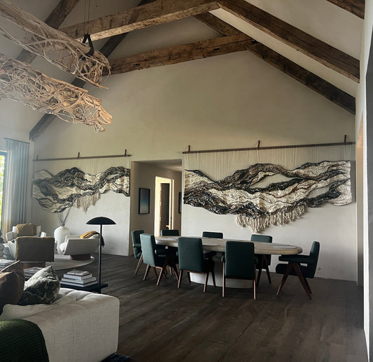 Large-scale woven wall art with undulating forms and natural fibers, designed by textile artist Rebecca Whitaker.