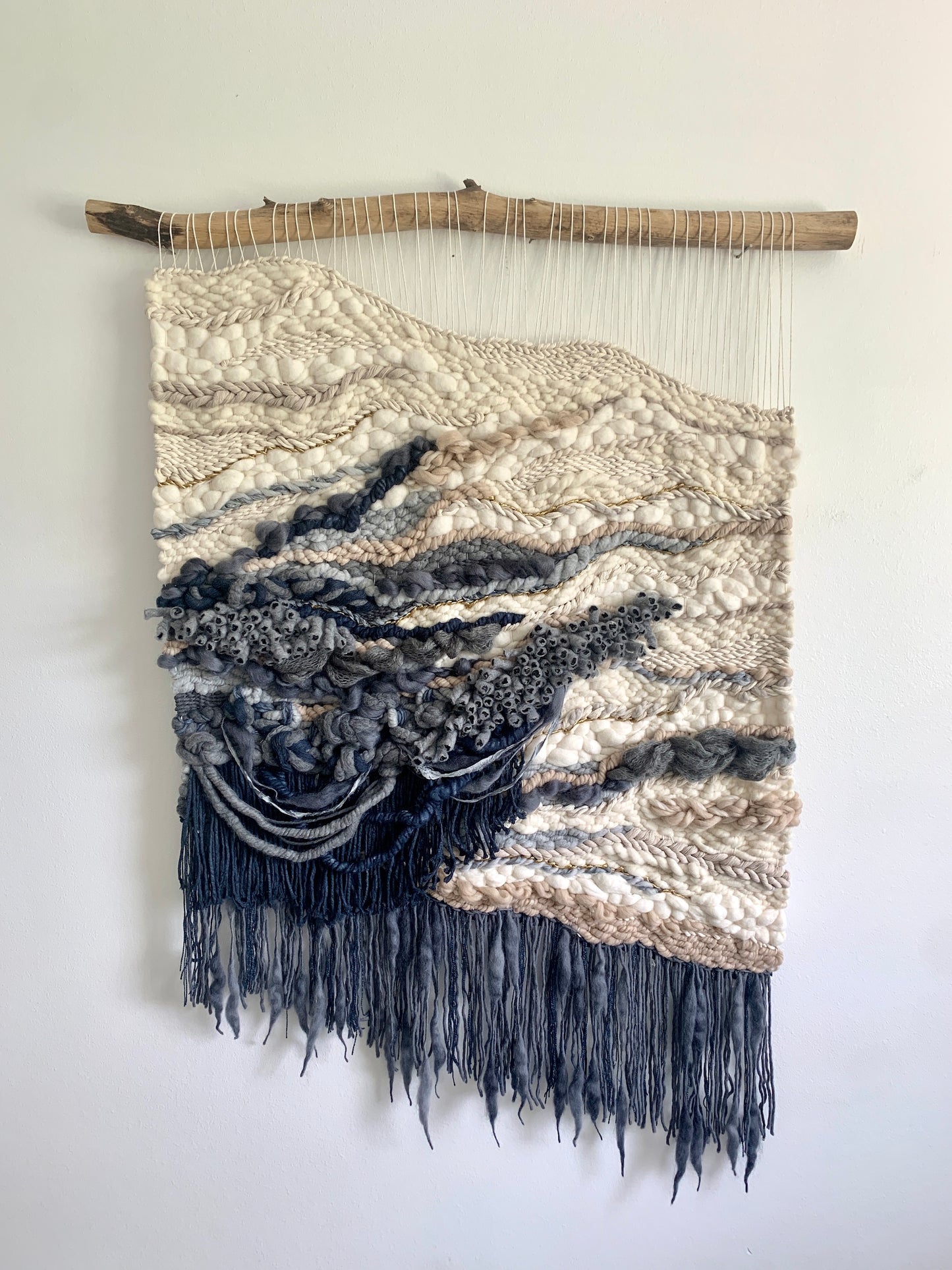 Mixed-fiber tapestry with tonal gradients and a sculptural, asymmetrical silhouette.
oceanic design.