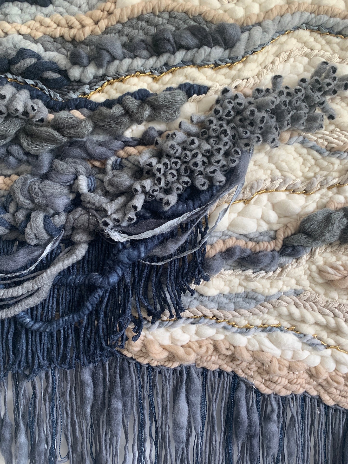 Mixed-fiber tapestry with tonal gradients and a sculptural, asymmetrical silhouette.
oceanic design. Oceanic feel with coral accent design.