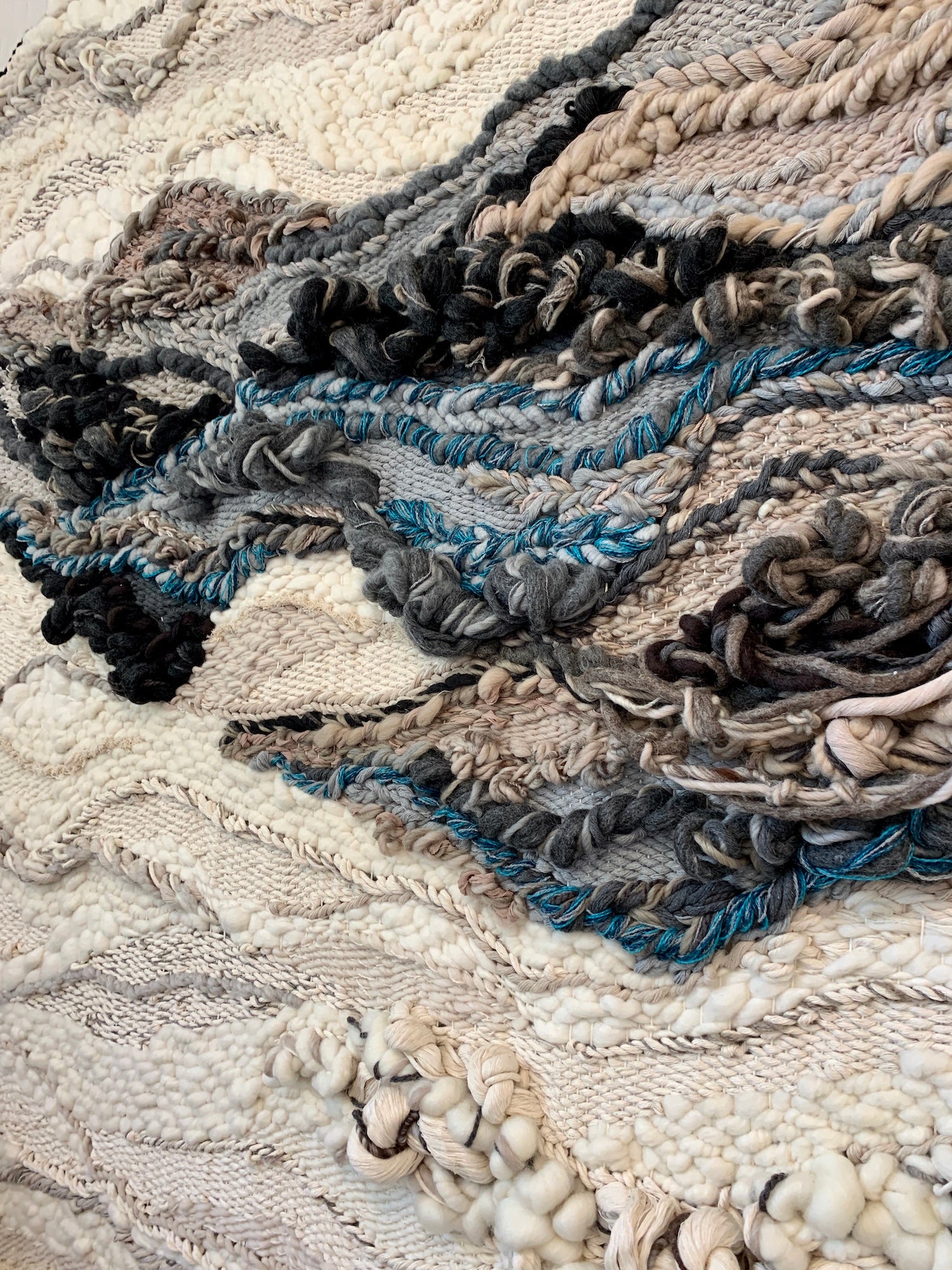 Large fabric panel with immersive texture and calming natural tones, ideal for tranquil spaces. Accent color in peacock blue, slate blue, gray, black, brown, beige and ivory.