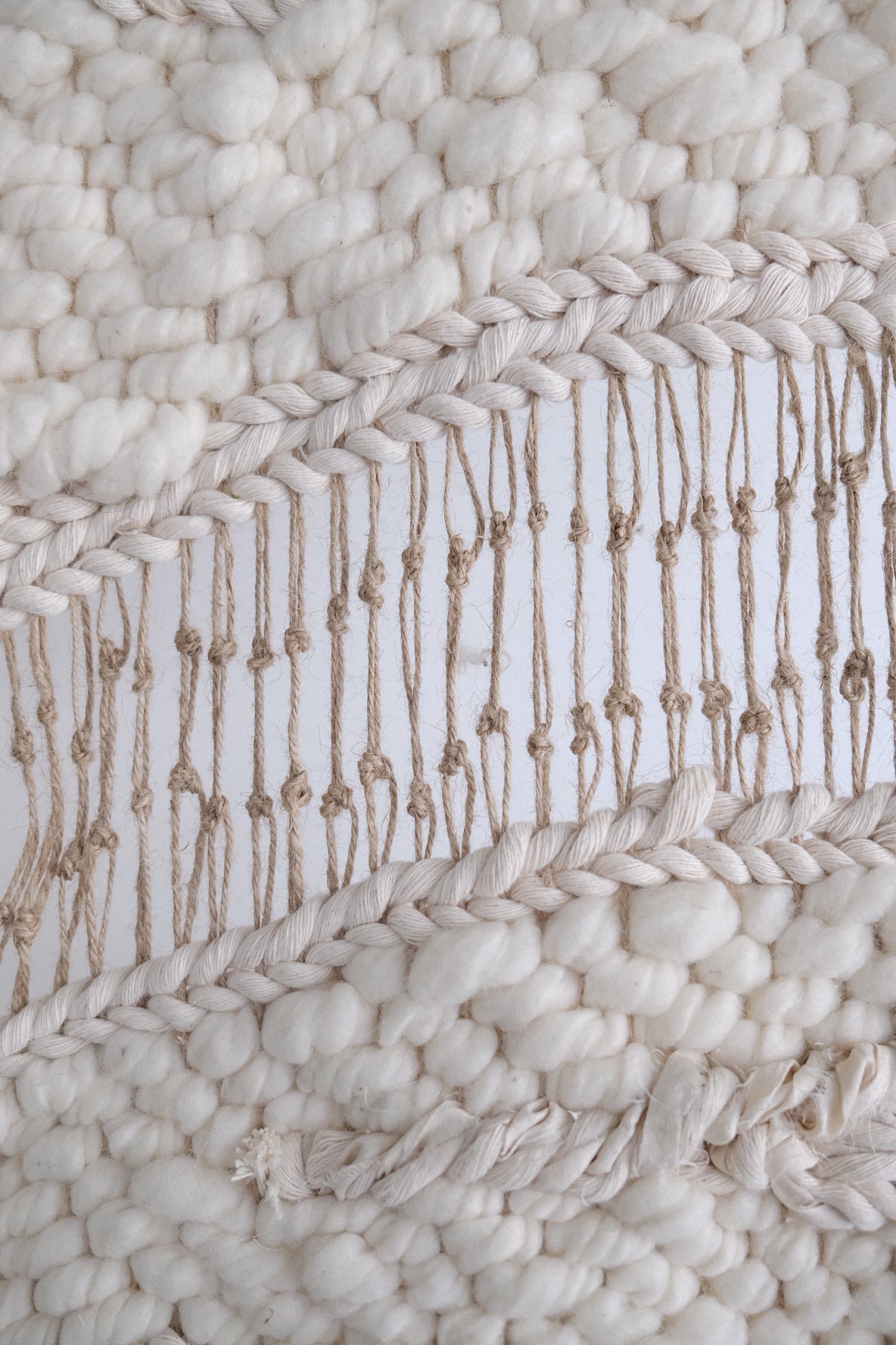 Handcrafted woven tapestry created from premium natural fibers. Statement textile art with layered textures and timeless, modern design.
