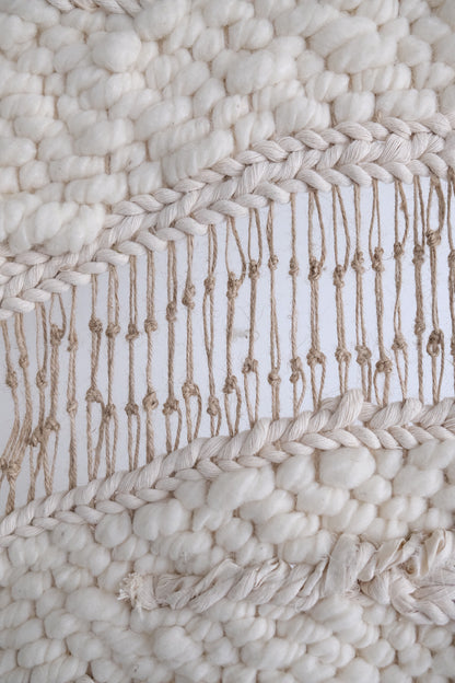 Handcrafted woven tapestry created from premium natural fibers. Statement textile art with layered textures and timeless, modern design.
