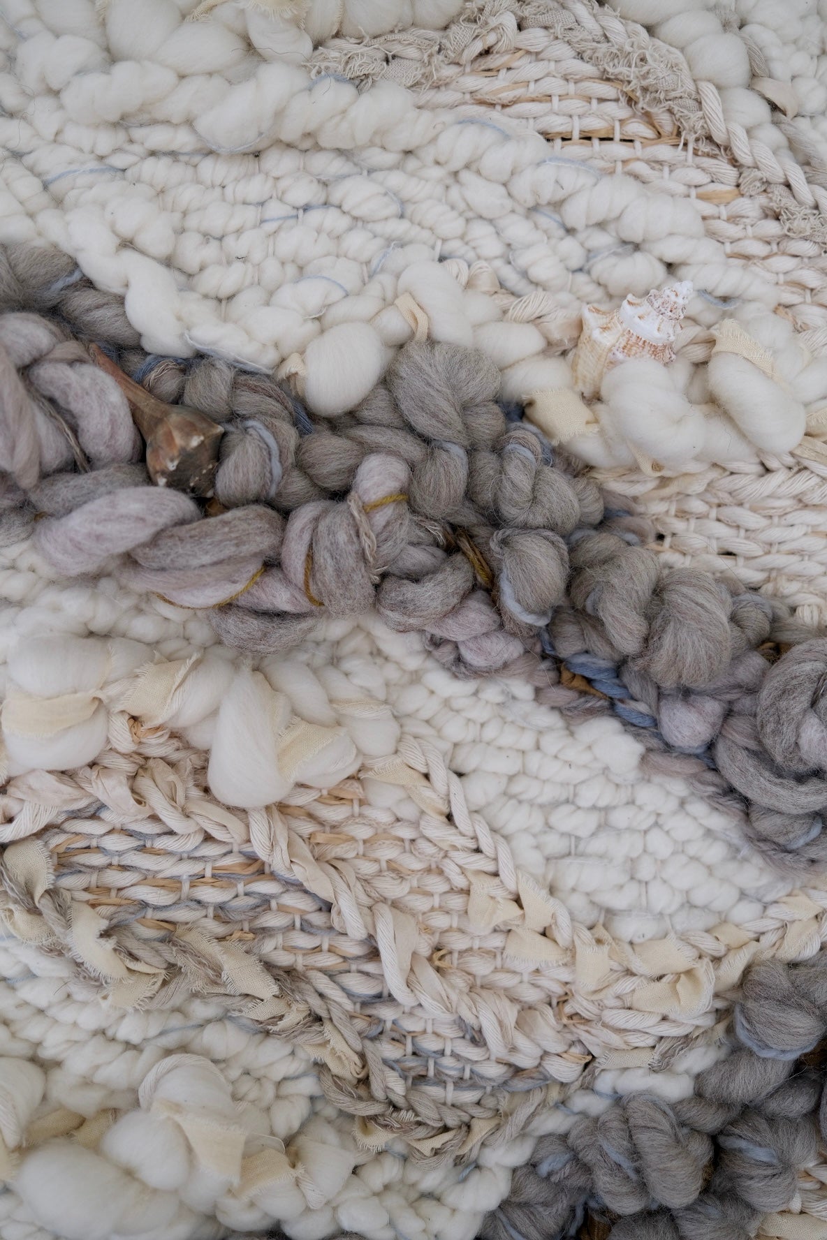 Textural detail of a woven textile artwork by Rebecca Whitaker, featuring wool, cotton, and organic fibers.