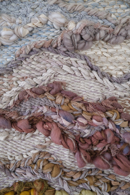 Close-up of intentional weaving techniques used by Rebecca Whitaker in a custom tapestry.