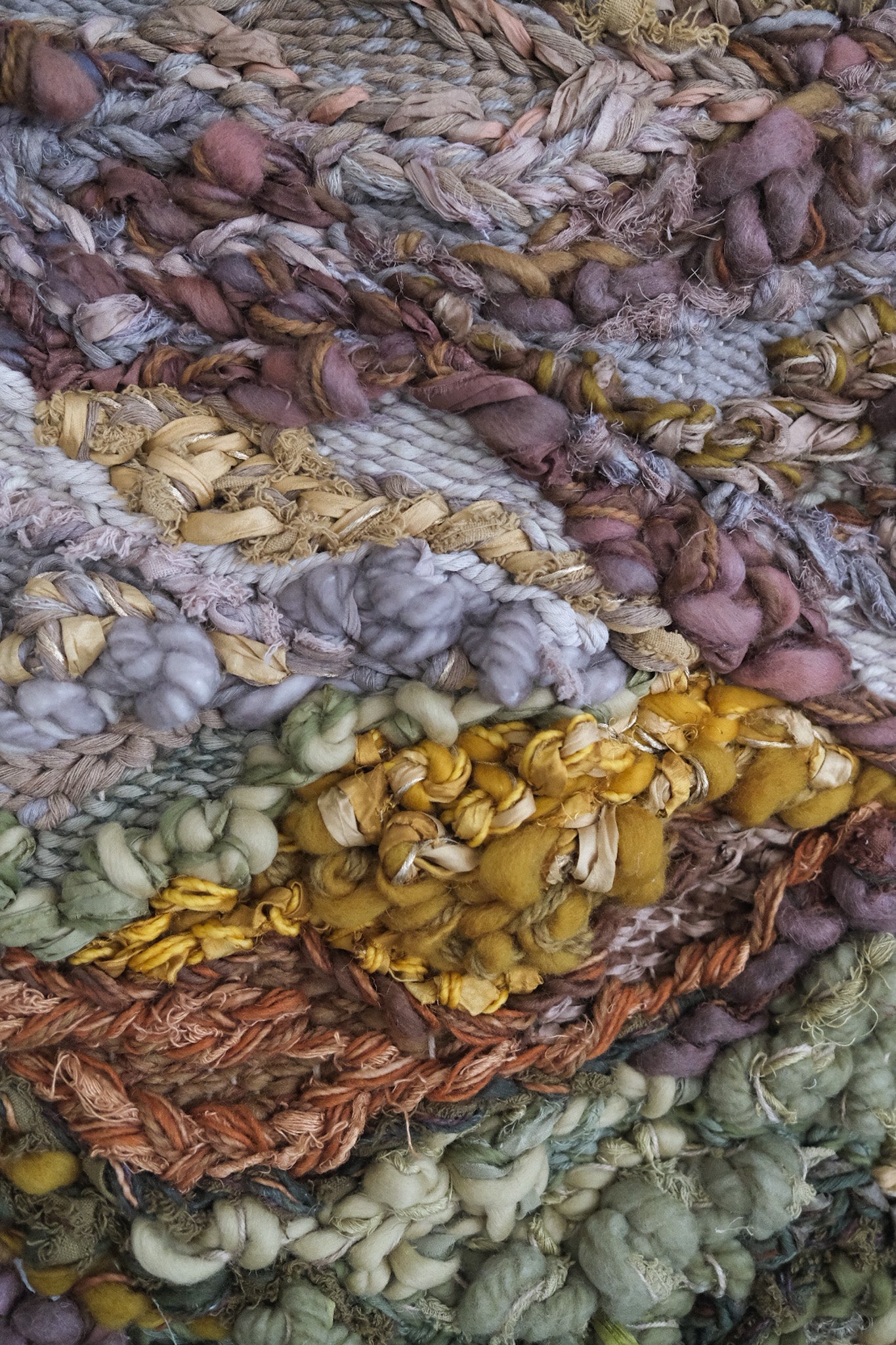 Close-up detail of handwoven tapestry by Rebecca Whitaker, showing natural fiber texture and knotting.