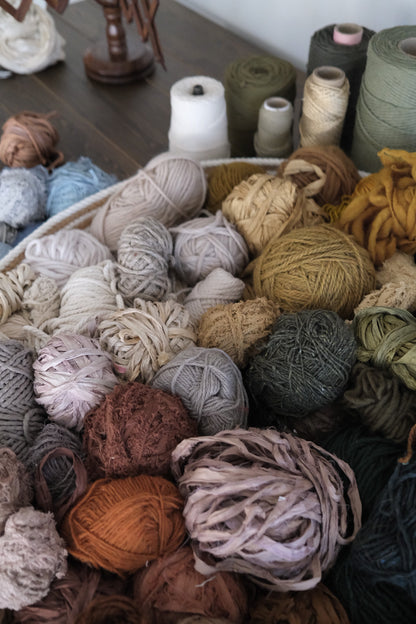 Symbolic material detail in a handwoven tapestry by Rebecca Whitaker, created through an intuitive design process.